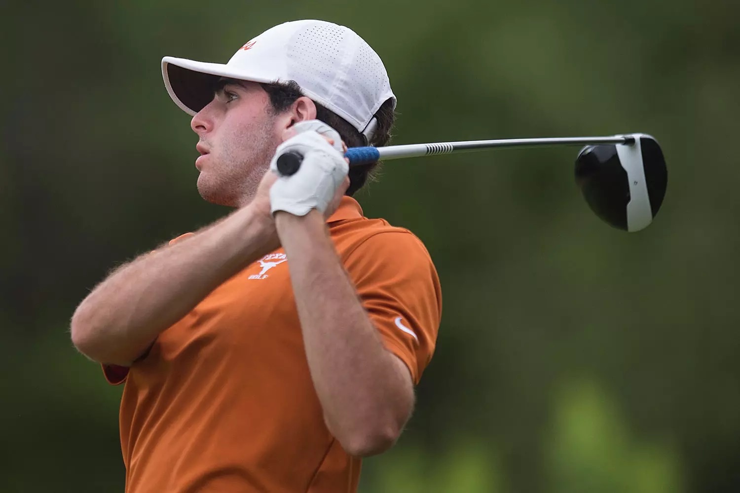 Spencer Soosman through the follow-through of his golf swing